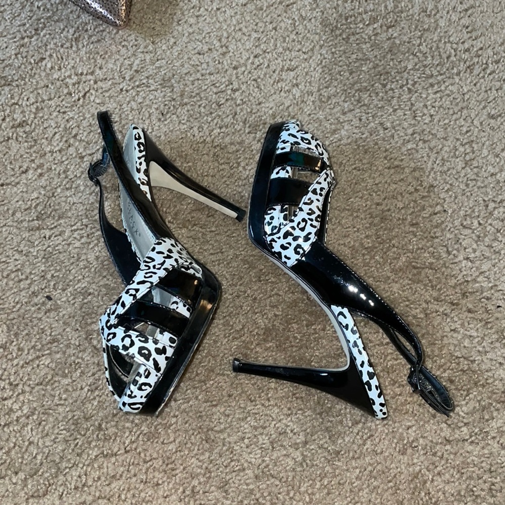 Black and white patent leather. Good Condition